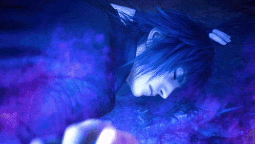 a person is laying down in a dark room with a hand reaching out