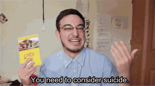 a man is holding a chef 's recipe book and saying you need to consider suicide