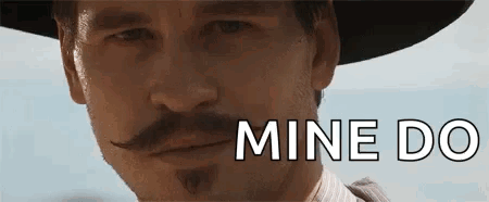 Tombstone Doc Holliday GIF - Tombstone Doc Holliday Wink GIFs