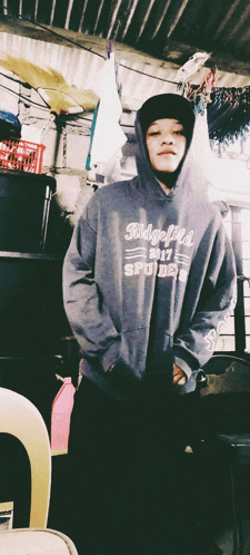 a person wearing a hoodie that says ridgefield spyder