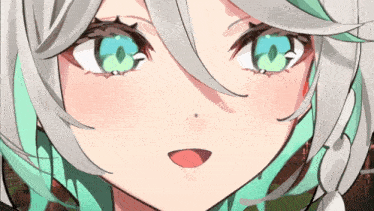 a close up of a girl 's face with green eyes