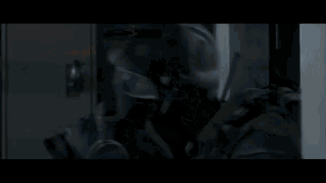 a blurry photo of a person walking in the dark