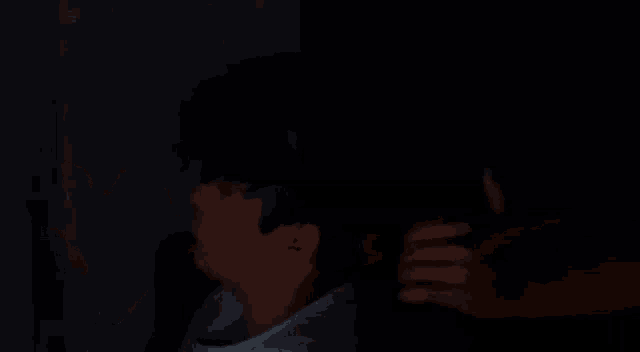 a blurry picture of a person 's face in the dark