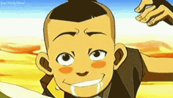 a close up of a cartoon character 's face with a hand behind him .