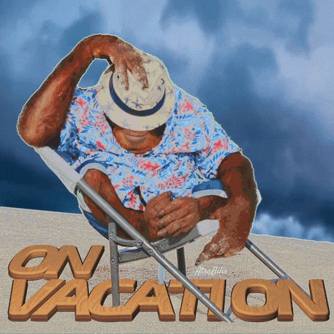 a man in a hat sits in a chair with the words on vacation written in wood