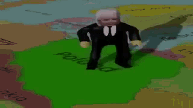 a doll in a suit and tie is standing on a map