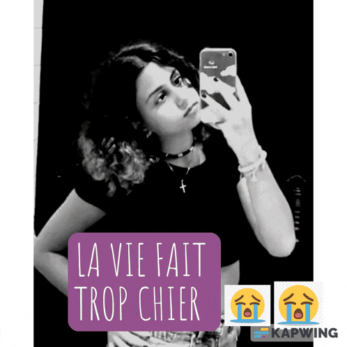 a woman taking a selfie with the words la vie fait trop chier on the bottom