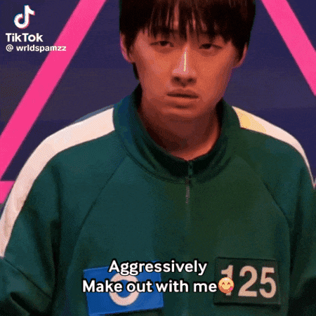 a man in a green jacket with the number 125 on it