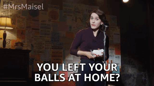 a woman stands in front of a microphone with the words you left your balls at home