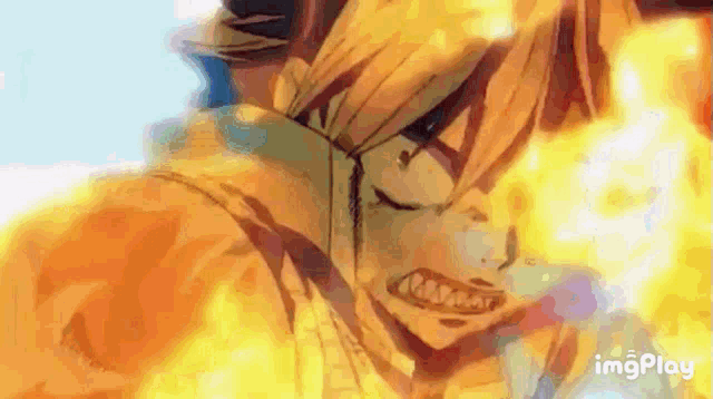 a close up of a person 's face with fire coming out of their mouth .