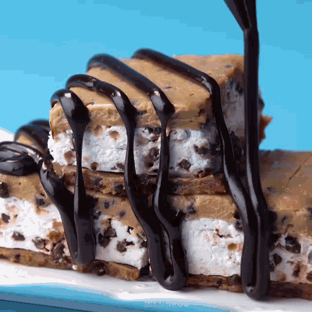 a cookie dough ice cream sandwich with chocolate sauce on top