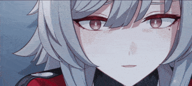a close up of a girl 's face with a red eye