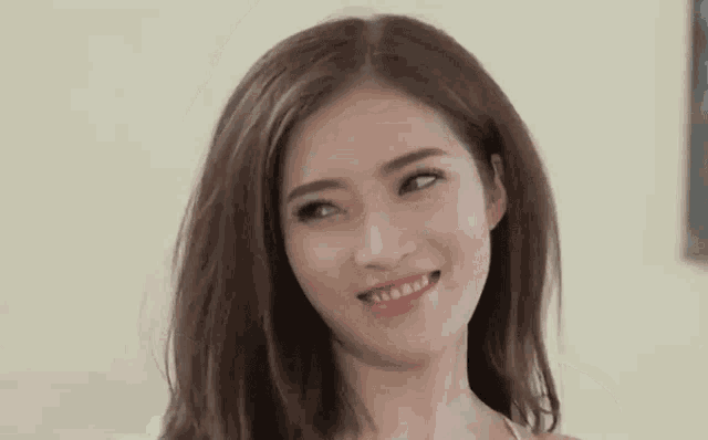 a close up of a woman making a funny face .
