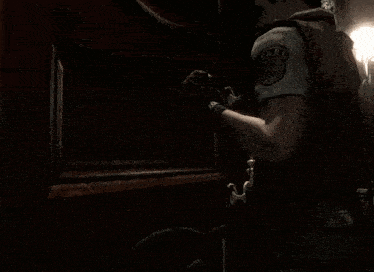 a man wearing a vest that says t.a.r.s. on the back of it