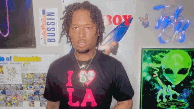 a man wearing a t-shirt that says i love la
