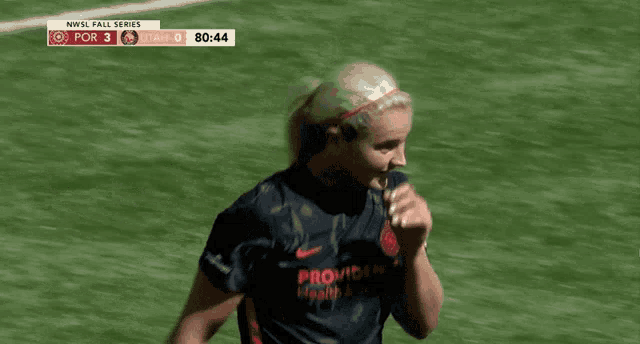 a female soccer player wearing a jersey that says providence