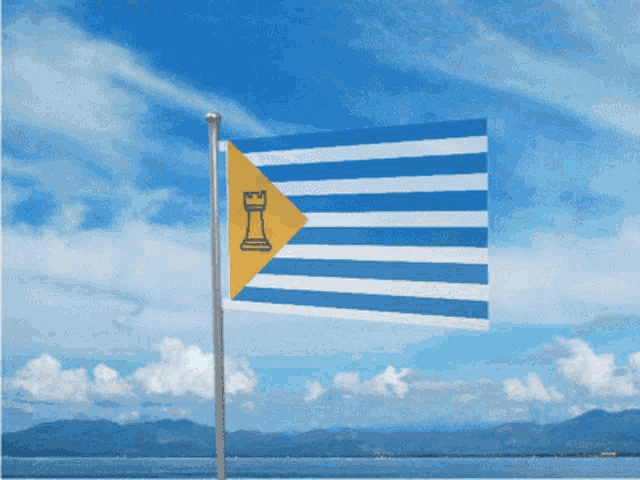 a blue and white flag with a yellow triangle on the bottom