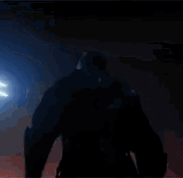 a person is being struck by lightning in a dark room .