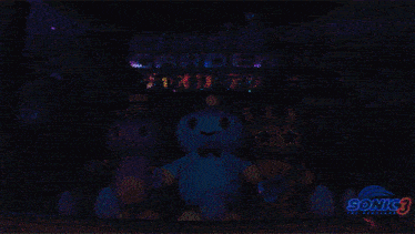 three stuffed animals are standing in front of a chaos garden sign