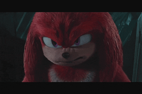 a close up of knuckles from sonic the hedgehog with glowing eyes