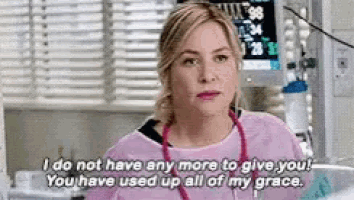 a nurse is talking to a patient in an intensive care unit .
