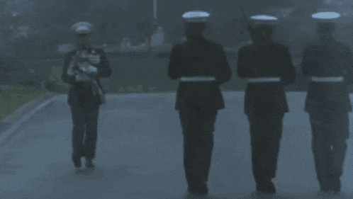 a man in a military uniform has medals on his chest including one that says ' u.s. marines ' on it