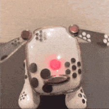 a toy dalmatian dog with a red light on its nose