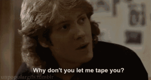 a close up of a man 's face with the words `` why don 't you let me tape you ? ''
