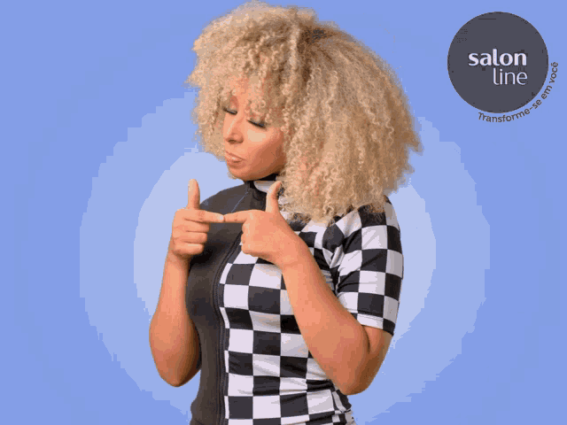 a woman pointing at herself with a salon line logo behind her