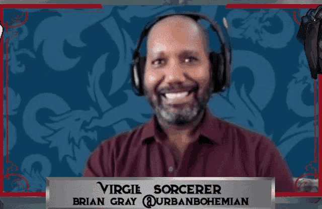 a man wearing headphones has the name virgie sorcerer on his name tag