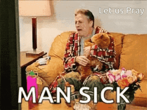 a man is sitting on a couch with a teddy bear and the words man sick