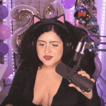 a woman wearing headphones and a cat ear headband