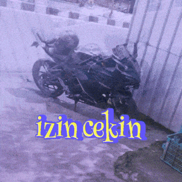 a motorcycle is parked in front of a purple wall with the words izin cekin written on it