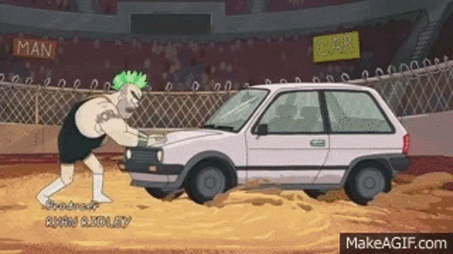 a man with green hair is pushing a pink car in a sandy arena .