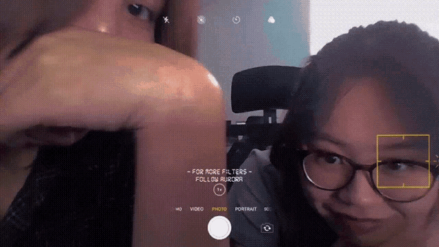 a person taking a picture of another person with the words " for more filters follow hashtag " on the bottom