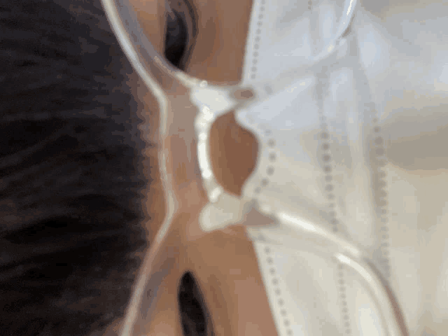 a close up of a person wearing a mask