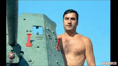 a shirtless man stands in front of a military vehicle with the words thinkiules below him