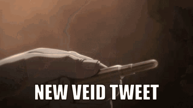 a hand is holding a bullet with the words " new void tweet " written below it