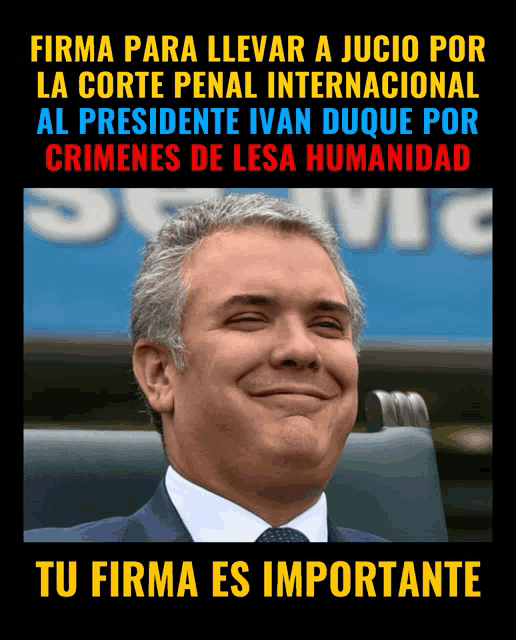 a man in a suit and tie is smiling in front of a sign that says " tu firma es importante "