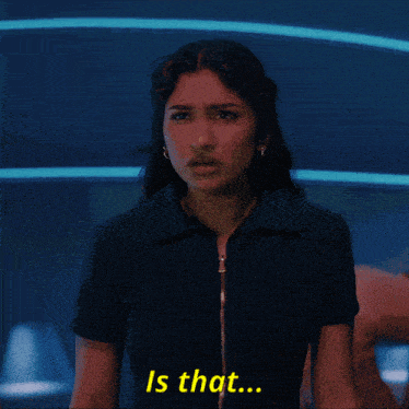 a woman in a blue shirt says " is that " in yellow letters