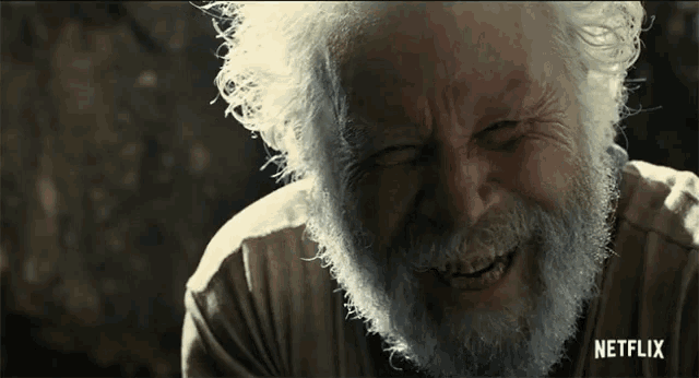 an older man with a beard is smiling in a netflix advertisement