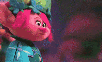 a cartoon character is standing on a pink surface in a room with other characters .