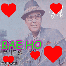 a man wearing glasses is surrounded by red hearts with bae ho written in green letters