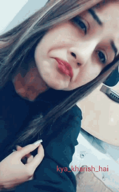 a woman taking a selfie with the name kya_kharish_hai on the bottom