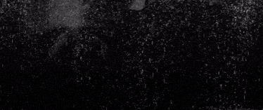 the rain is falling in slow motion on a black background