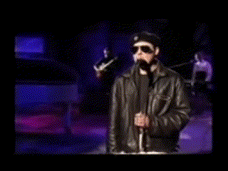 a man wearing a hat and sunglasses is covering his mouth .