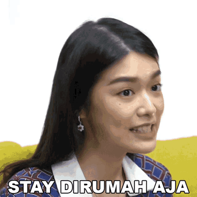 a woman is sitting on a yellow couch with the words stay dirumah aja on her face