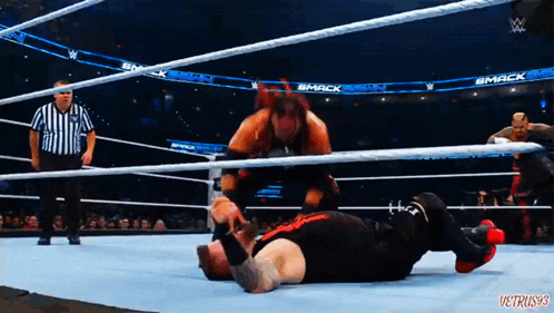 wrestlers in a wrestling ring with the words smack on the walls