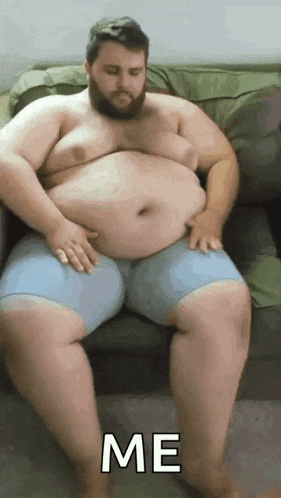 a fat man with a beard is sitting on a couch with his hands on his belly and the word me written on the bottom