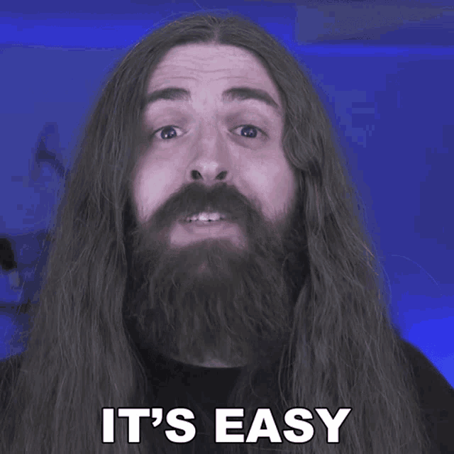 a man with long hair and a beard says it 's easy in white letters